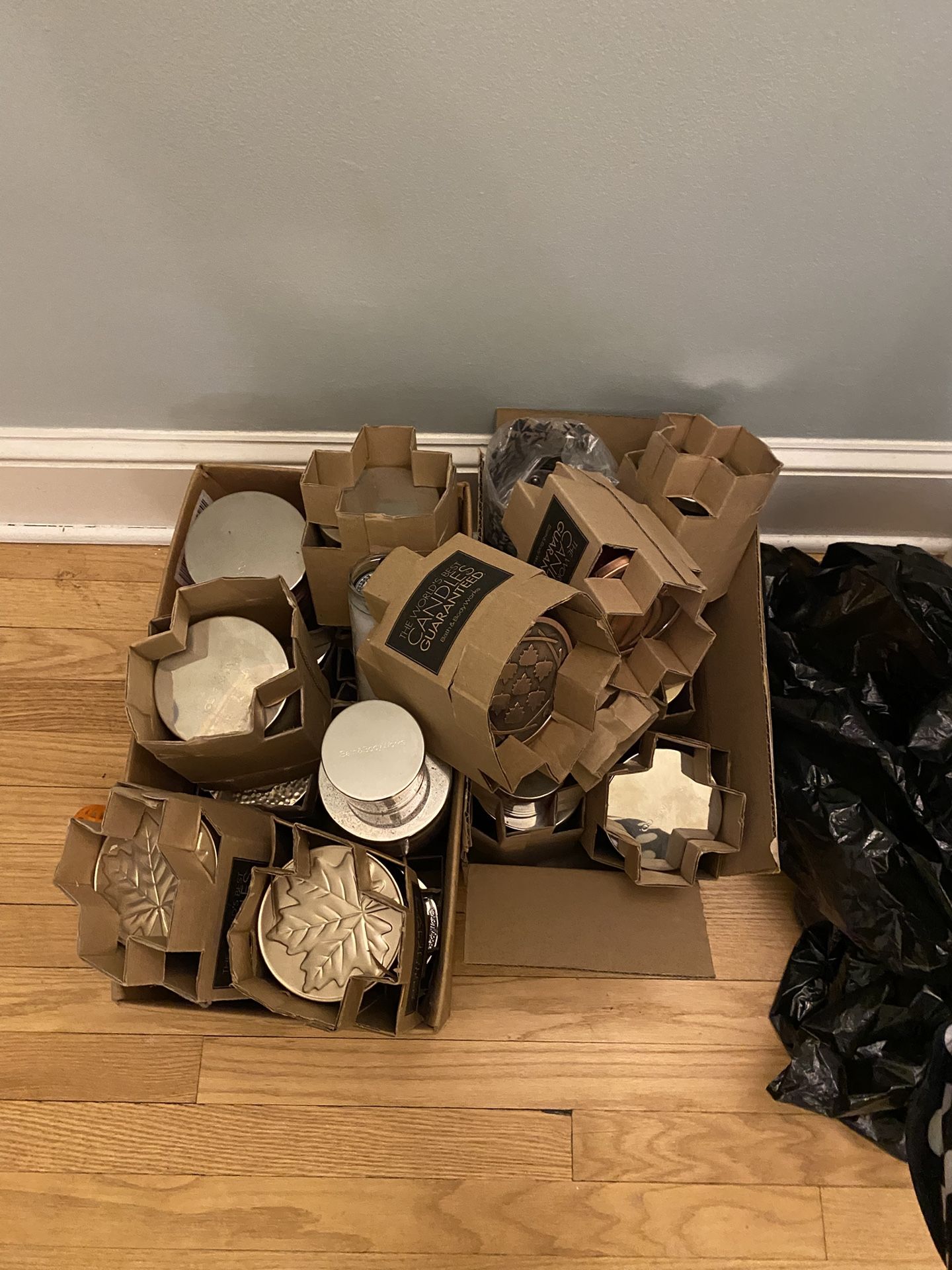 Several Boxes Of Bath And Body Works Candles