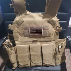 Brand New Tactical Vest With Tons Of Excessories And Can Hold Front and Back Plates ' NO Plates Included