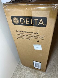 Delta Clarifi Tankless Under Sink 6-stage Reverse Osmosis System in a sealed box with faucet.