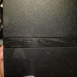 Playstation 2 with game controllers