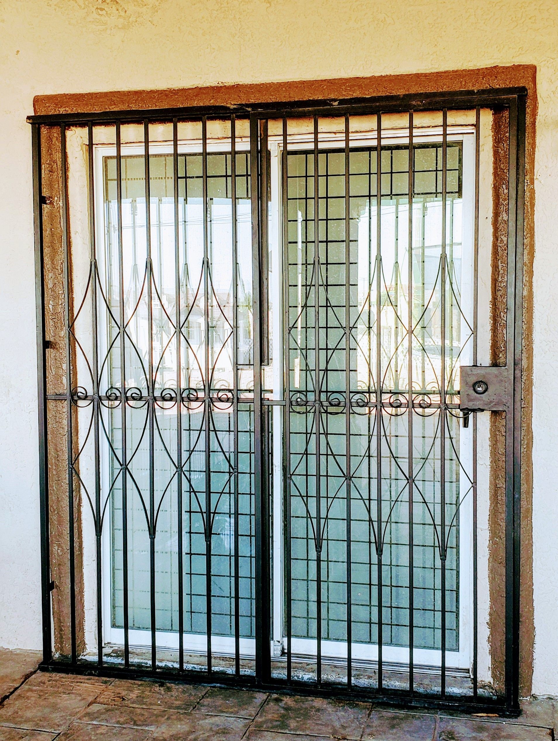 Rough iron double door fence