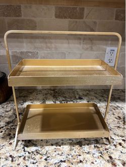 Gold stand $10