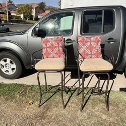 Pair Of Used Swivel Top Barstools With Cushioned Seats And Throw Pillows 