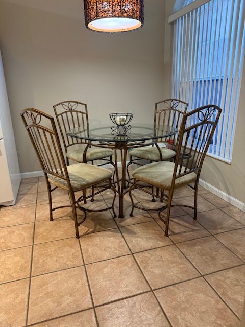 Fine quality, superior construction, solid and sturdy glass top dining table and four chairs