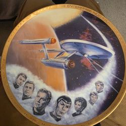 Star Trek collector's plate, specifically featuring the USS Enterprise and the original crew from Star Trek: The Original Series. 