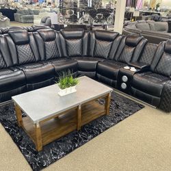 Double recliner sectional with Bluetooth speakers and phone charging ports