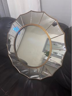 Mirror with gold trim