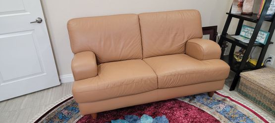 Leather sofa (love seat) and matching chair. Very good condition. North Las Vegas.