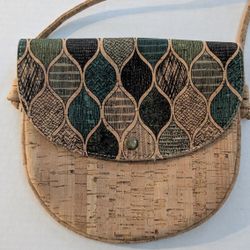 vegan cork shoulder bag with a patterned flap, similar to models listed as YOKCORK small cork crossbody bags. 