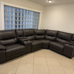 Leather reclining sectional sofa with cup holders
