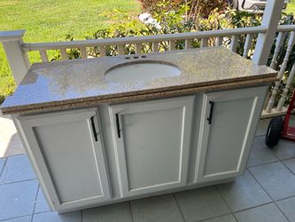 Bathroom vanity with granite and backsplash