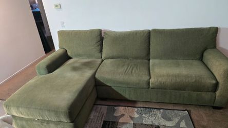 Jonathan Louis olive green sectional sofa with a left-facing chaise.
