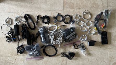 Large assortment of electronic cables, power adapters and remotes