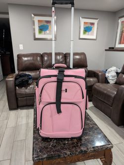 pink Rockland softside upright carry-on suitcase