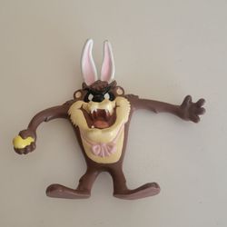 Vintage 1988 Looney Tunes Easter Tasmanian Devil Taz Bendable Figure 
Figurine. 6" tall. Weight 4.5oz plus shipping materials.
Made of Molded PVC/Rubb