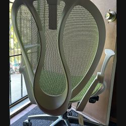 Unused Office Chair- Mesh green And White. Rolls On Wheels. Adjustable.