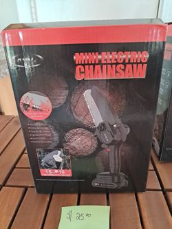 NIB Mini Electric Chainsaw