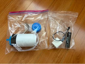 Water pump, 5V power bank and 5 V AC adapter for a 5 gallon water bottle