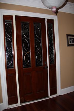 Designer Door (3’ x 8’) and two sidelites (1.4’ x 8’) including glass.