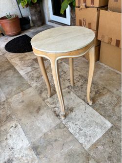 Round wooden side table