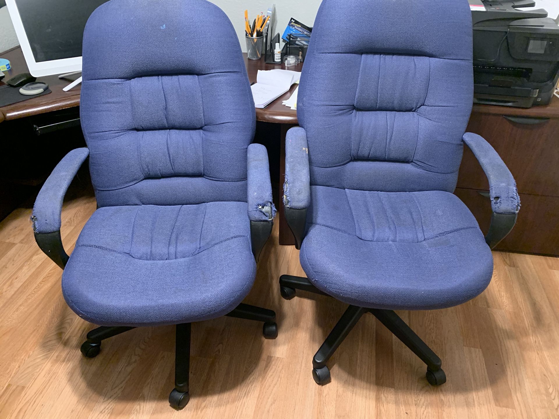 Two matching office chairs on wheels both for $10