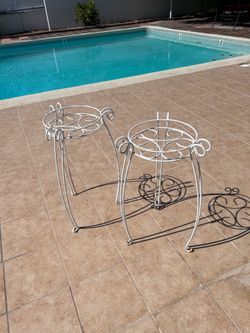 Two wrought iron plant stands