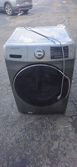 Samsung front load washing machine in graphite gray. Modern design with multiple wash cycles, digital control panel, and large-capacity drum. Clean in