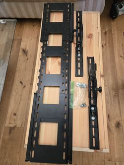 Frame to hold flat screen TV on the wall