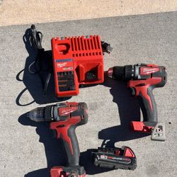 2 Milwaukee drills , 1 battery and charger 