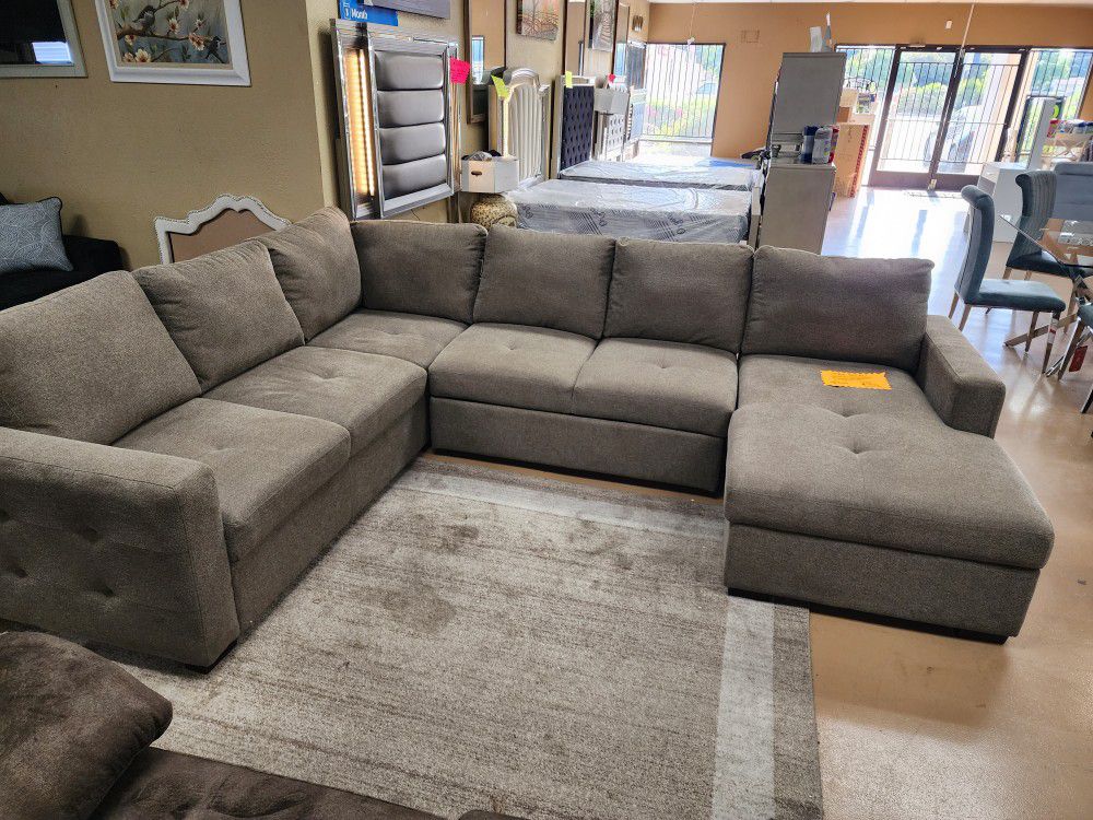 Sectional Sleeper With Storage !! Come See It 