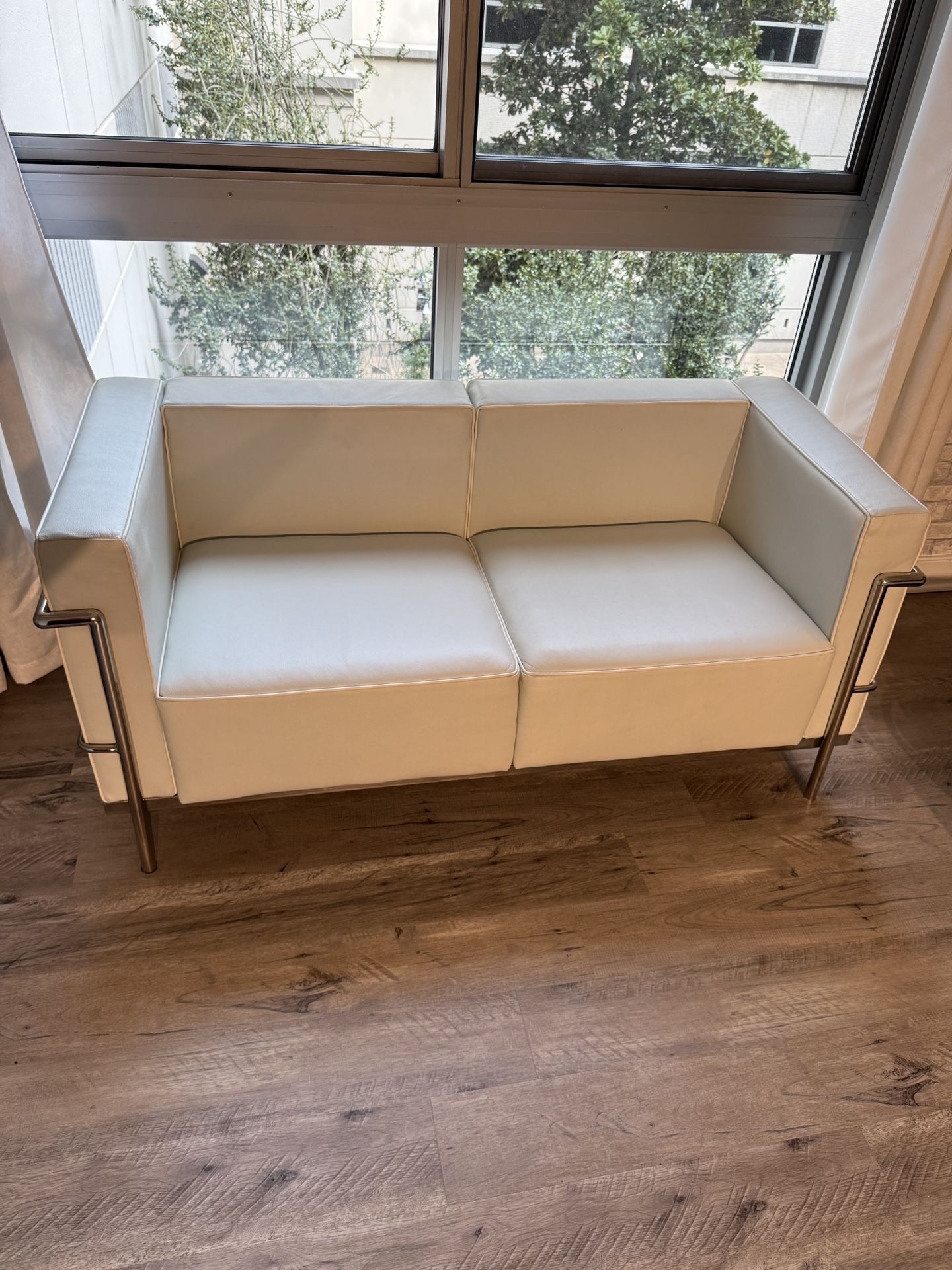 Contemporary Leather Loveseat with Encasing Frame (Priced to sell!)