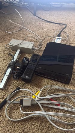Black Nintendo Wii with motion plus controller