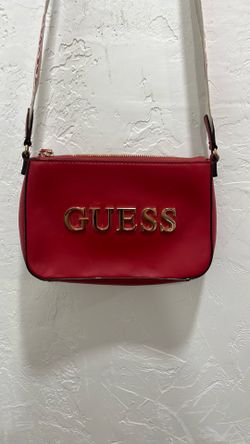 Woman’s red guess purse