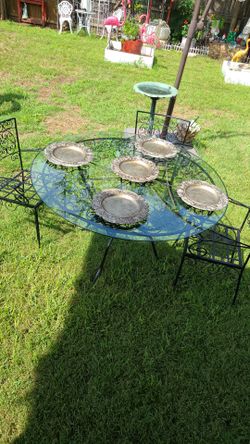 Metal and glass patio dining set; a patio umbrella can also be added.
