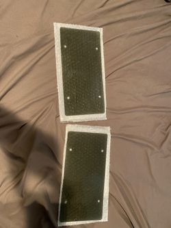 Two tinted license plate covers