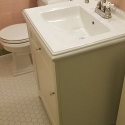 Porcelain Sink, Cabinet, and Faucet