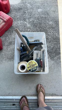 Box full of tile and drywall tools