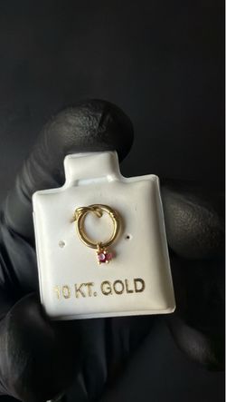 10K yellow gold hinged nose hoop with red gemstone dangle