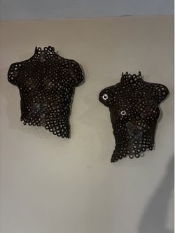 Metal artwork male and female torso