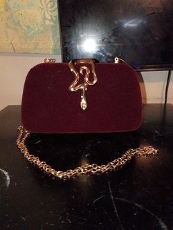 Maroon colored clutch