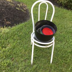 A Chair As An Holder For Plants