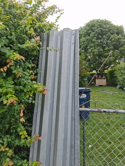 Corrugated Metal Hurricane Panels 14 in. wide with pre-drilled holes.