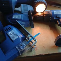 4 pice combo drill saw light sander used a couple times