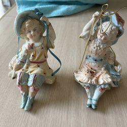$20  Pair Of Porcelain Dolls On Swings