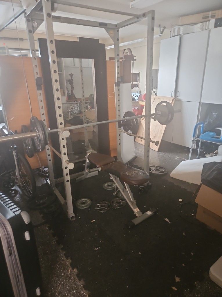 MOVING SALE: WEIGHTS AND BENCH AND CAGE