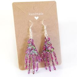 Purple green star glitter Halloween skeleton hands dangle earrings with gold hooks 