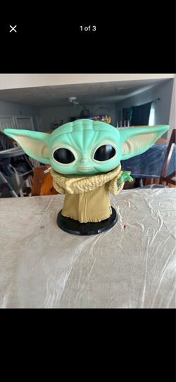 “Grogu (Baby Yoda) Star Wars collectible figure.”
