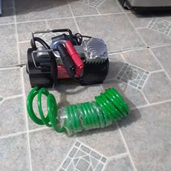 New Vehicle Air Compressor Comes With Flashlight In Excellent Condition,  $40.