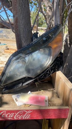 2010- thru 2012 Subaru legacy left head light