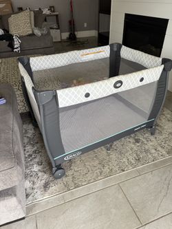 Pack And Play With Changing Table And Storage Connection